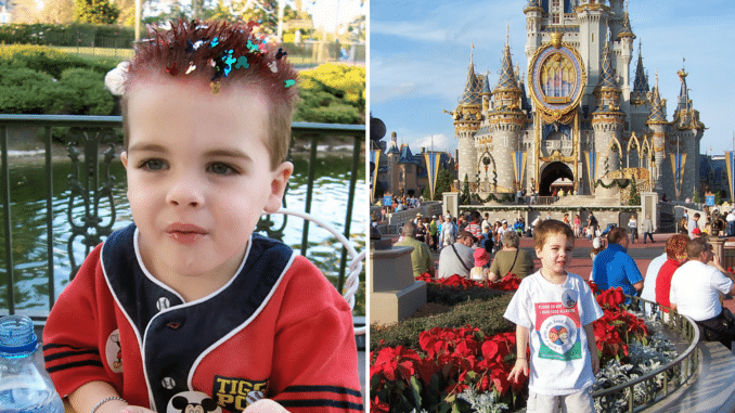 A young child in front of Cinderella's Castle at Walt Disney World's Magic Kingdom