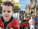 A young child in front of Cinderella's Castle at Walt Disney World's Magic Kingdom